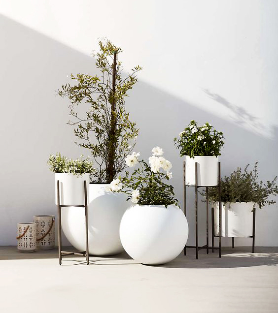 Elevate Your Greenery with Planters with Stands: A Comprehensive Guide